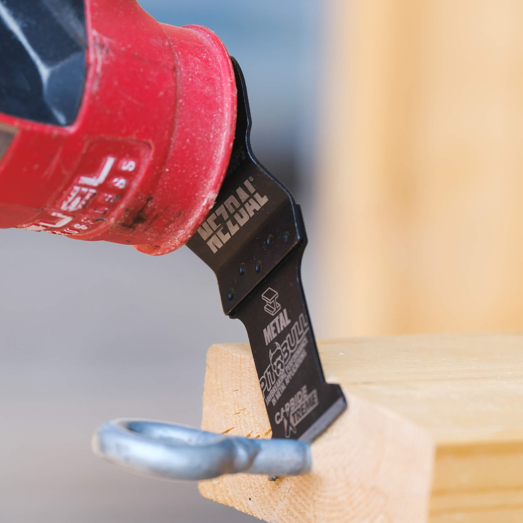 Multi-tool blade cutting a metal hook